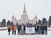 Students pose for a group photo on snow in Moscow